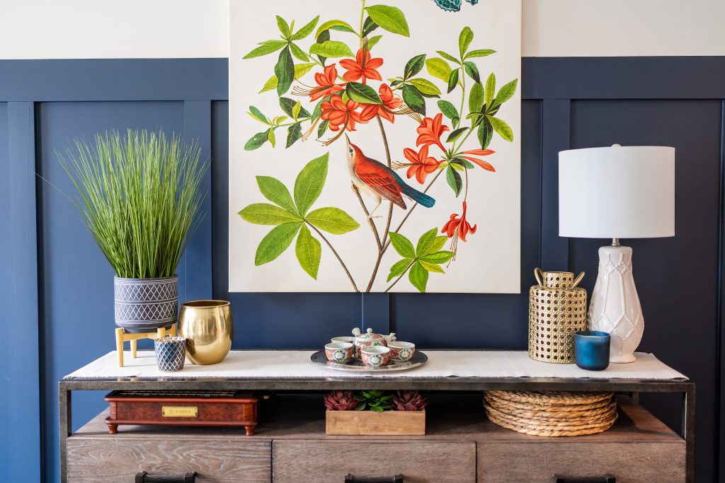 nightstand and artwork in navy bedroom