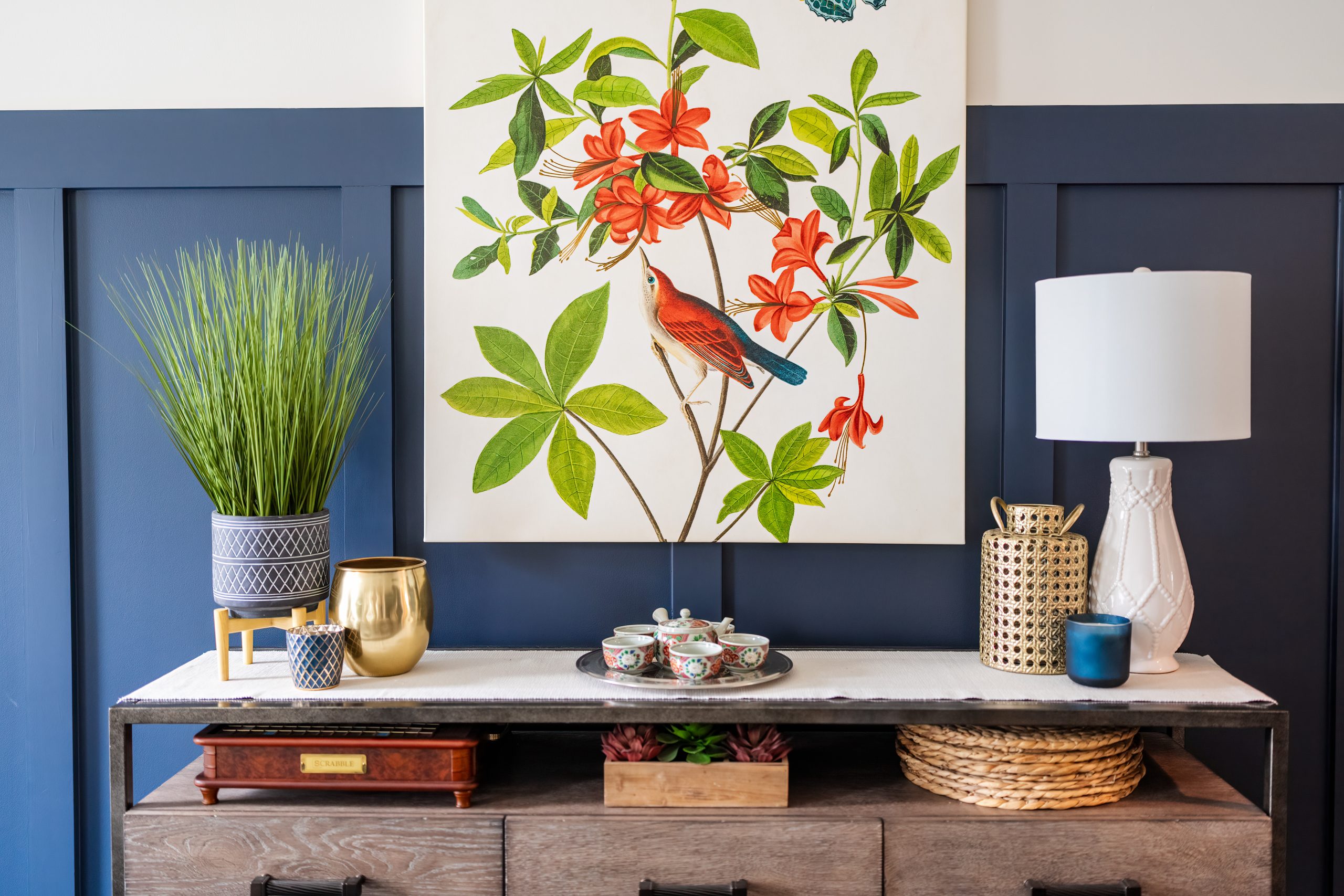nightstand and artwork in navy bedroom